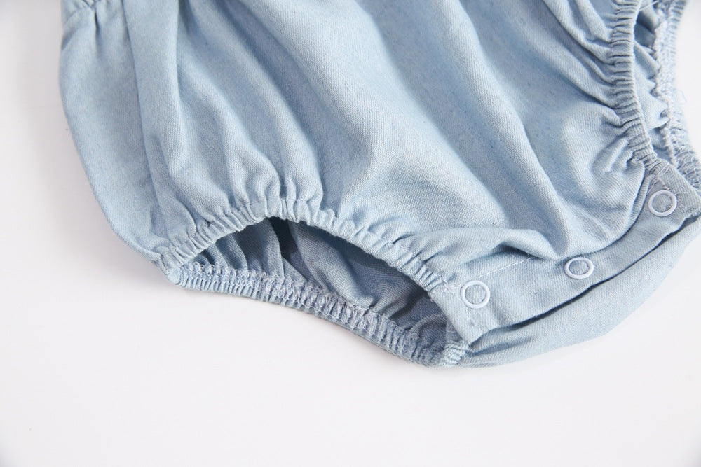 Baby girl sleeveless backless outfit featuring square collar and lace design in denim fabric, available in multiple colors.