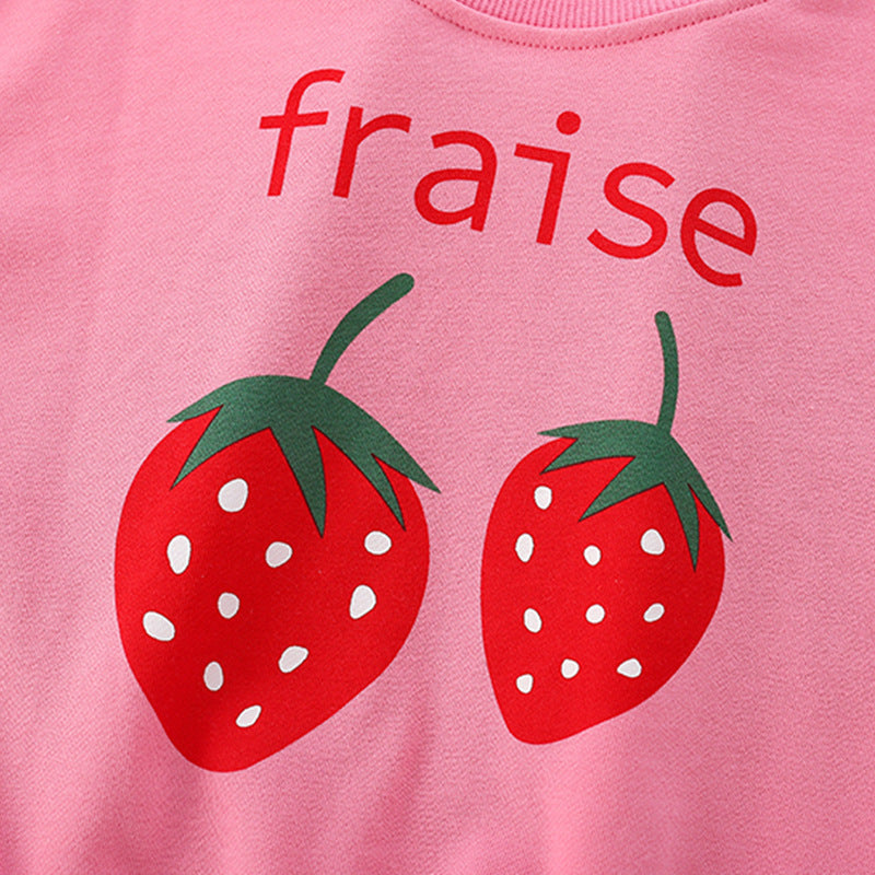 Baby girl wearing a strawberry print pattern crewneck terry hoodie in pink, showcasing a vibrant and playful design.
