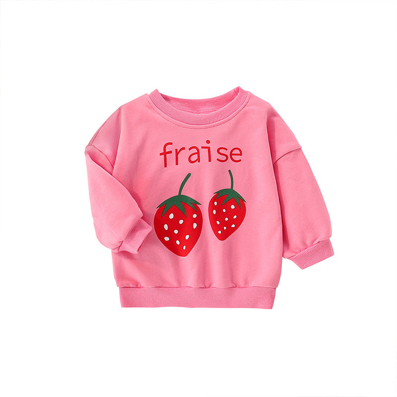 Baby girl wearing a strawberry print pattern crewneck terry hoodie in pink, showcasing a vibrant and playful design.