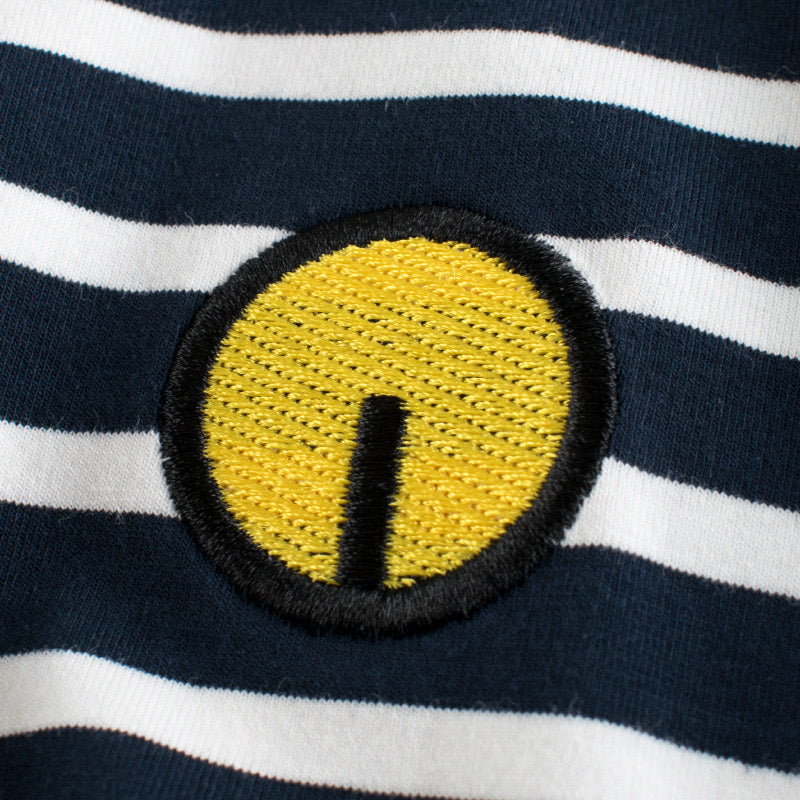 Baby girl sleeveless vest top featuring a striped pattern and embroidered design in black color.