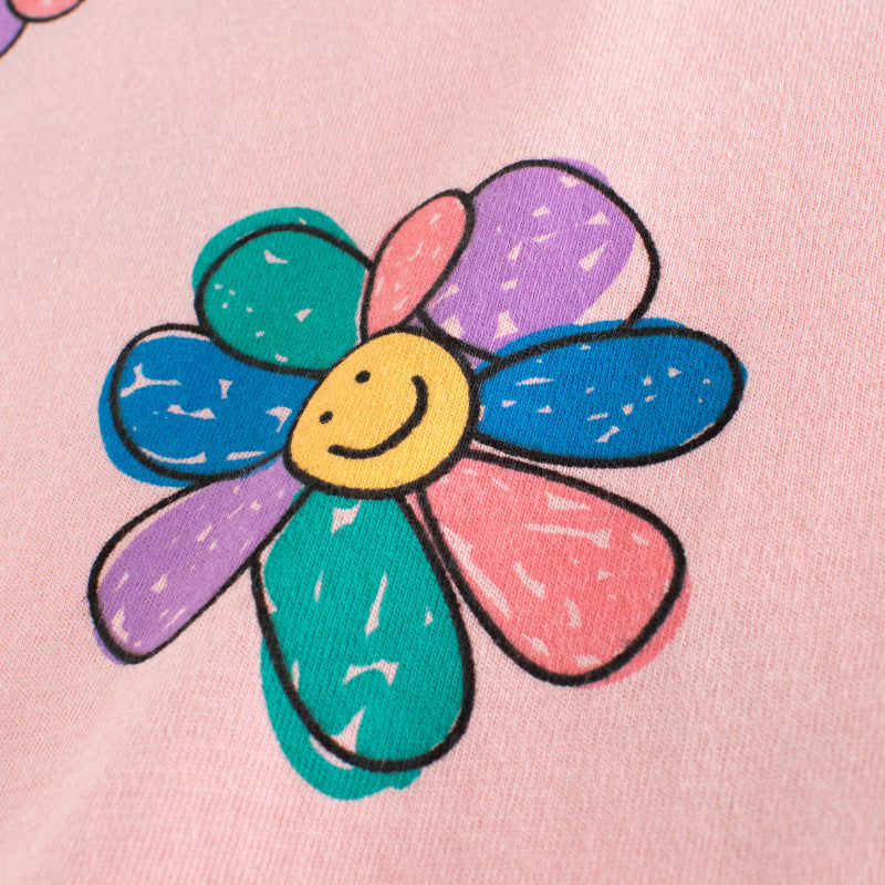 Baby girl wearing a pink sunflower print short sleeved t-shirt, perfect for summer days, showcasing a vibrant floral design.