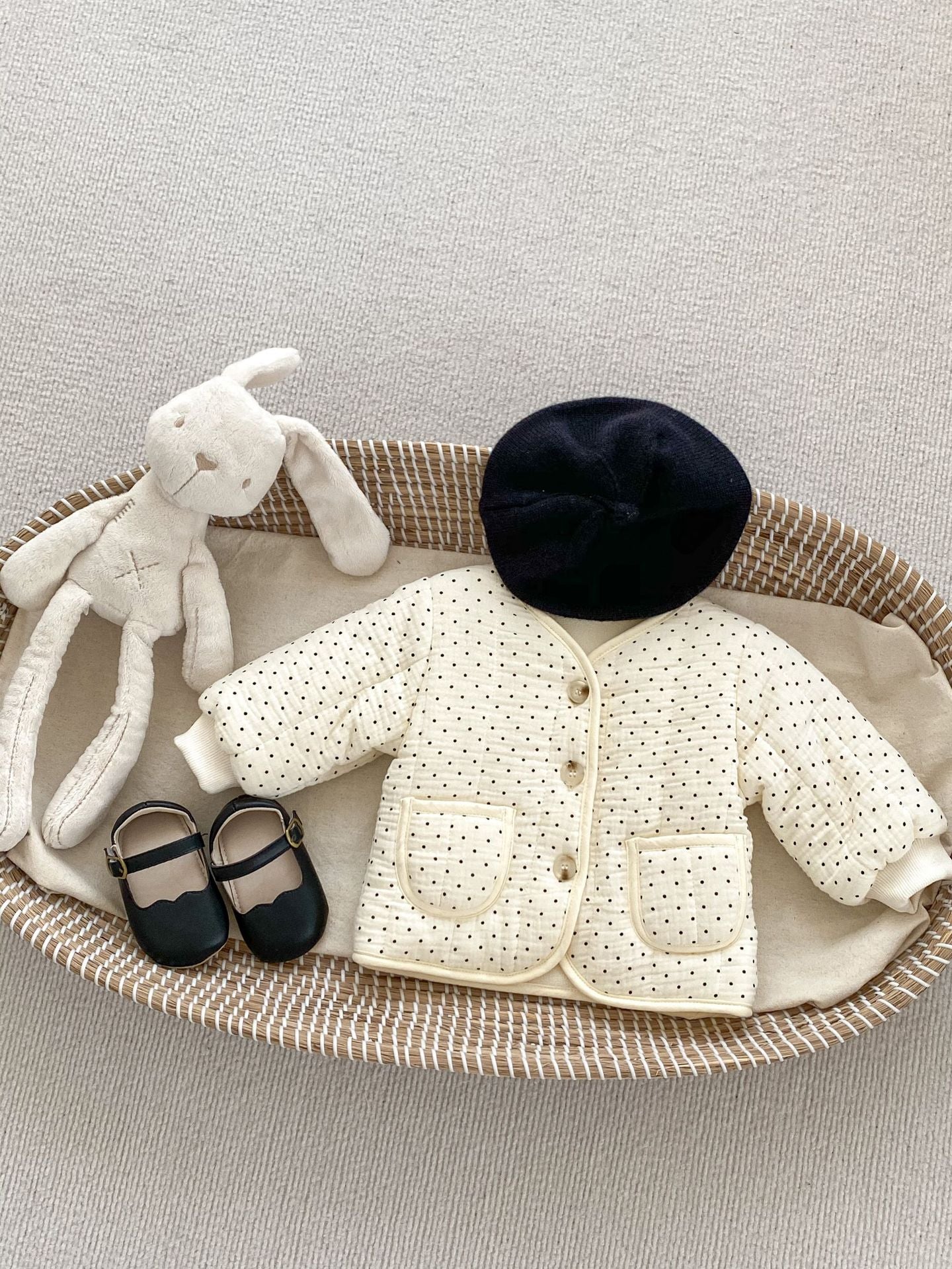 Baby outfit with stuffed bunny.