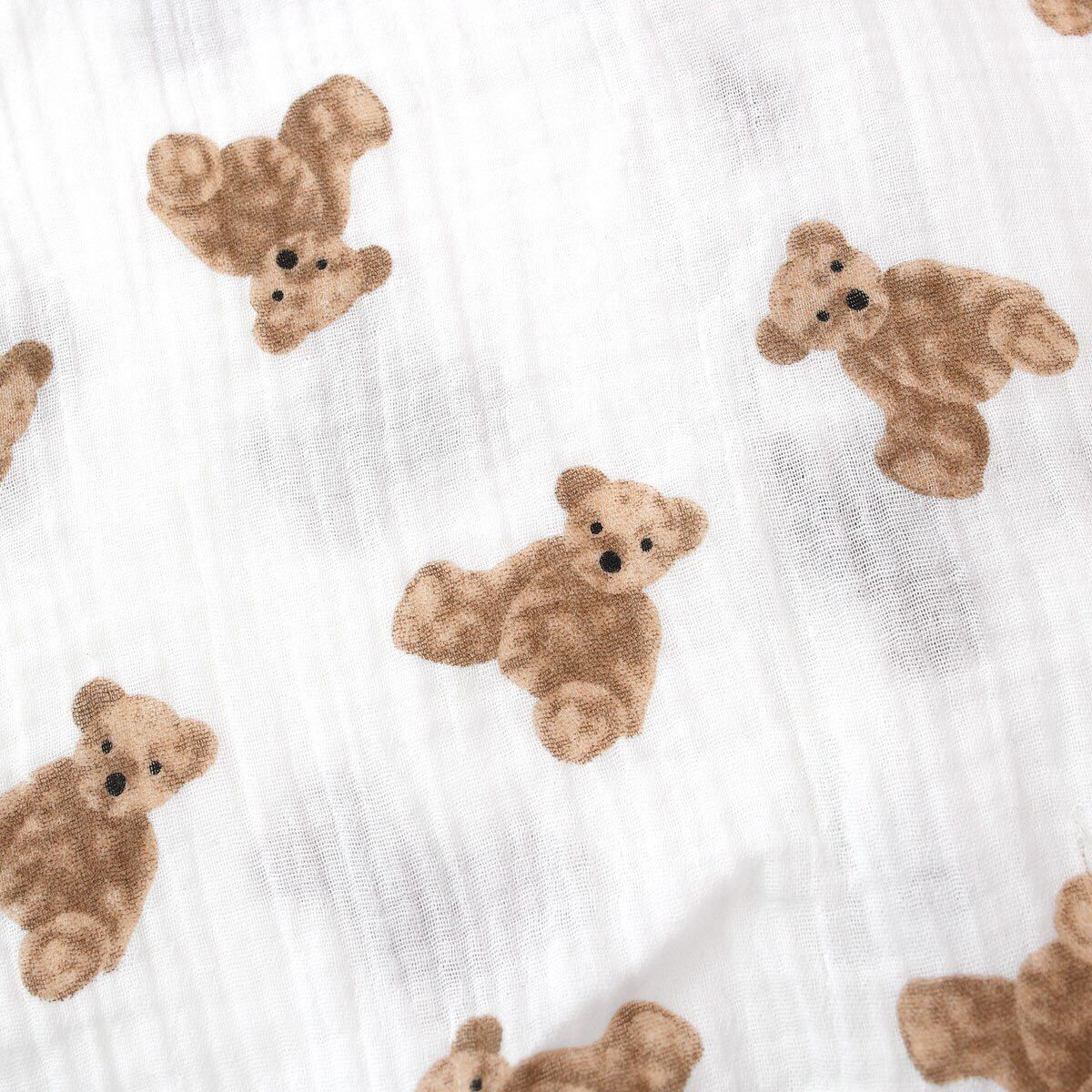 Baby girls' romper featuring bear print pattern and lace design, round collar, and long sleeves, perfect for stylish infants.