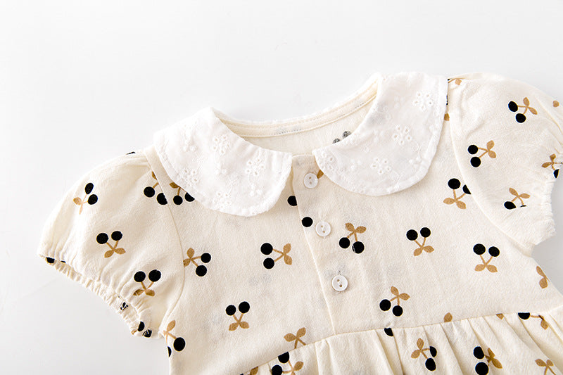 Baby girls cherry print onesie featuring a doll collar and puff sleeves in apricot color.