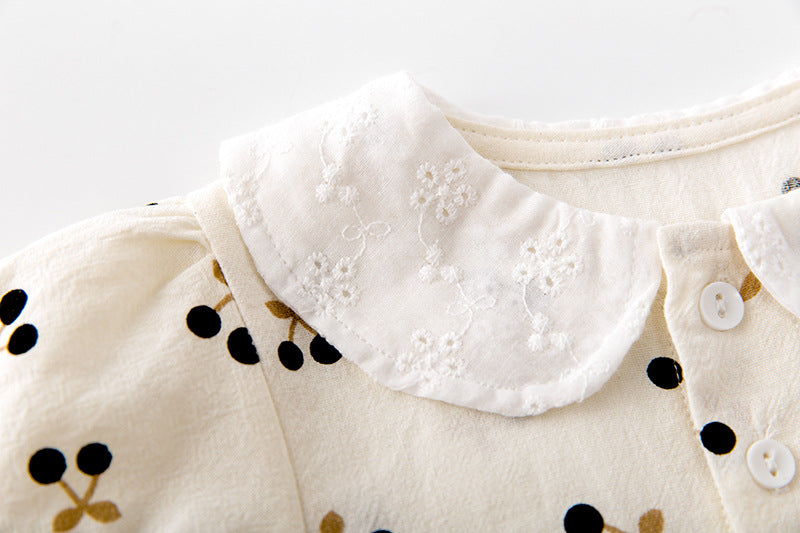 Baby girls cherry print onesie featuring a doll collar and puff sleeves in apricot color.