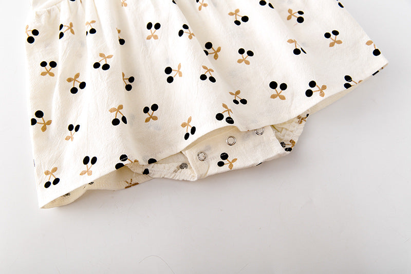 Baby girls cherry print onesie featuring a doll collar and puff sleeves in apricot color.