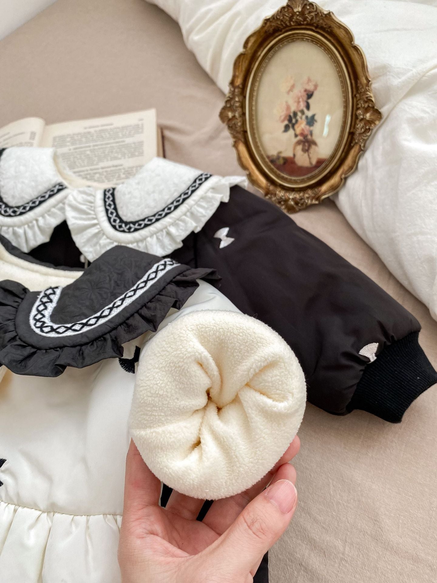 Baby girls' winter coat in blue and beige with floral pattern, made from soft cotton and polyester blend.