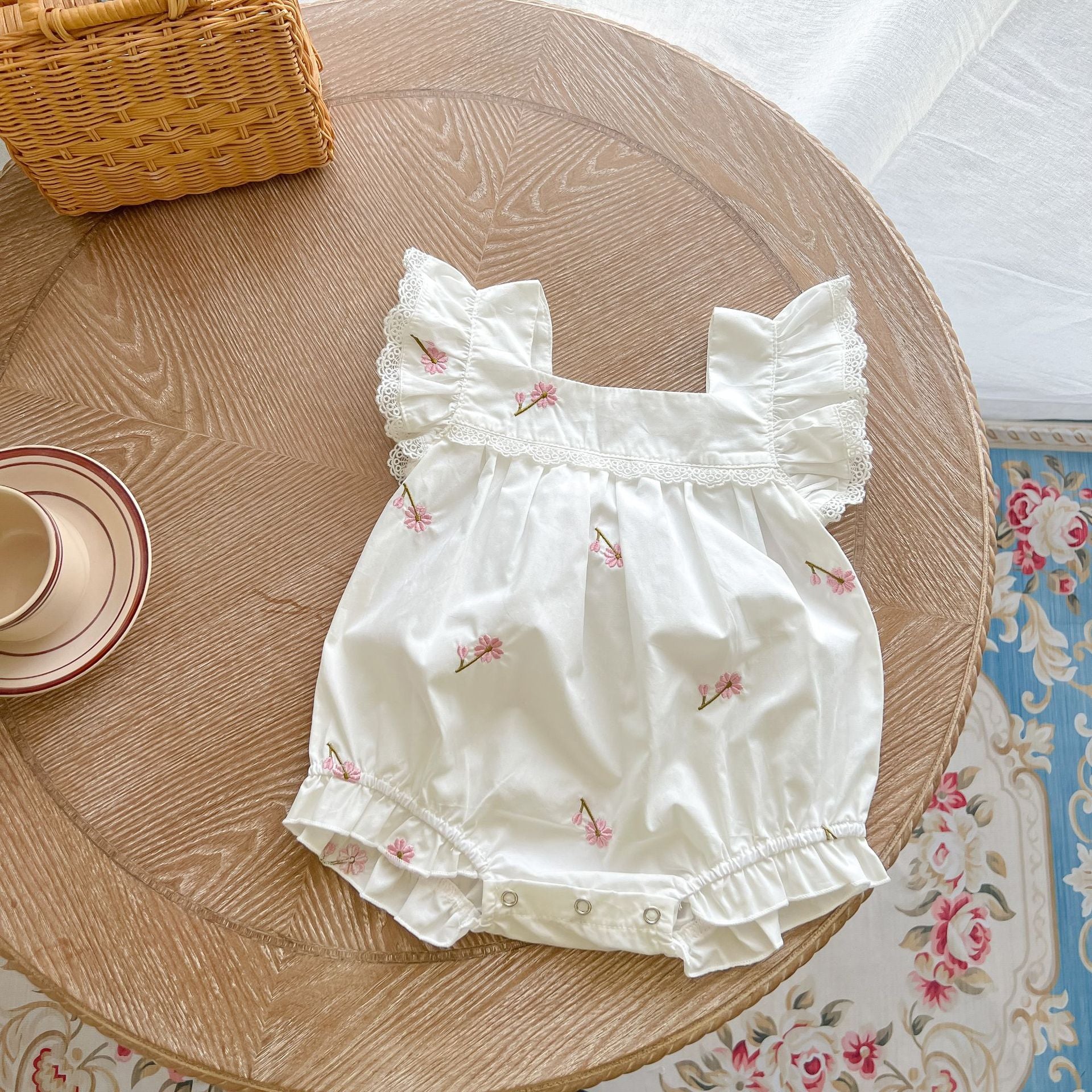 Baby girls floral print ruffle design square-collar summer cotton onesie in white and apricot colors, showcasing a stylish floral pattern.