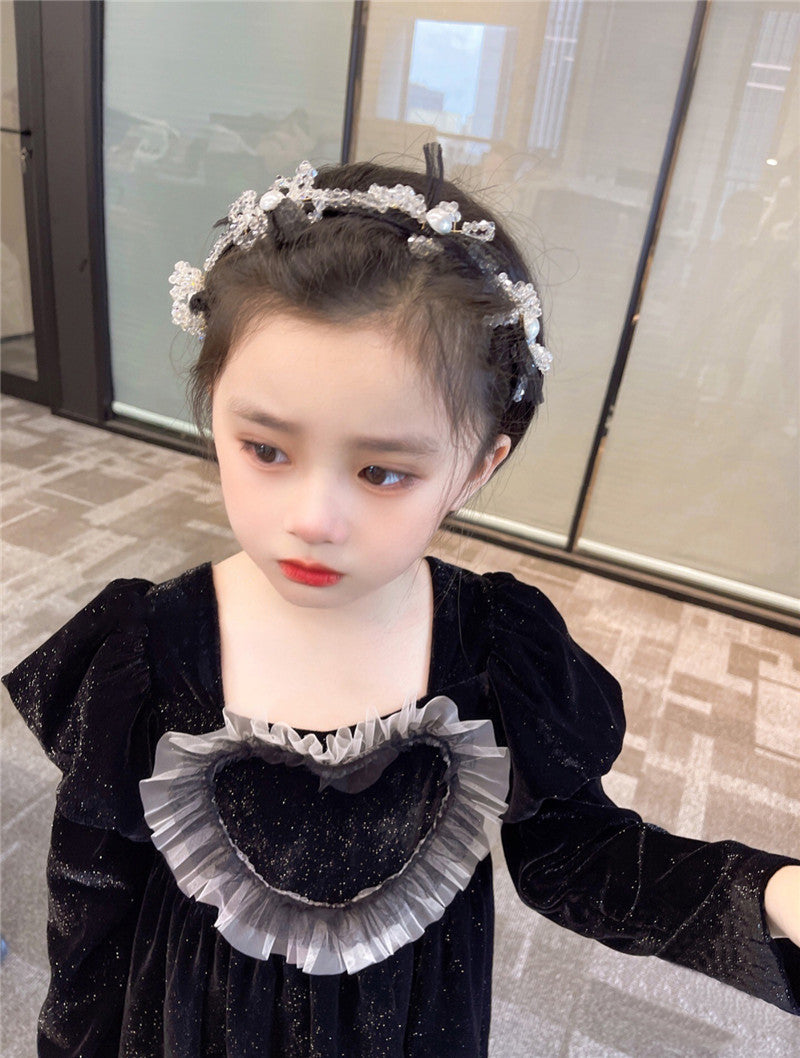 Baby Girls Heart Shape Ruffle Square Neck Long Sleeved Black Princess dress featuring a heart pattern and ruffle details, perfect for young girls.