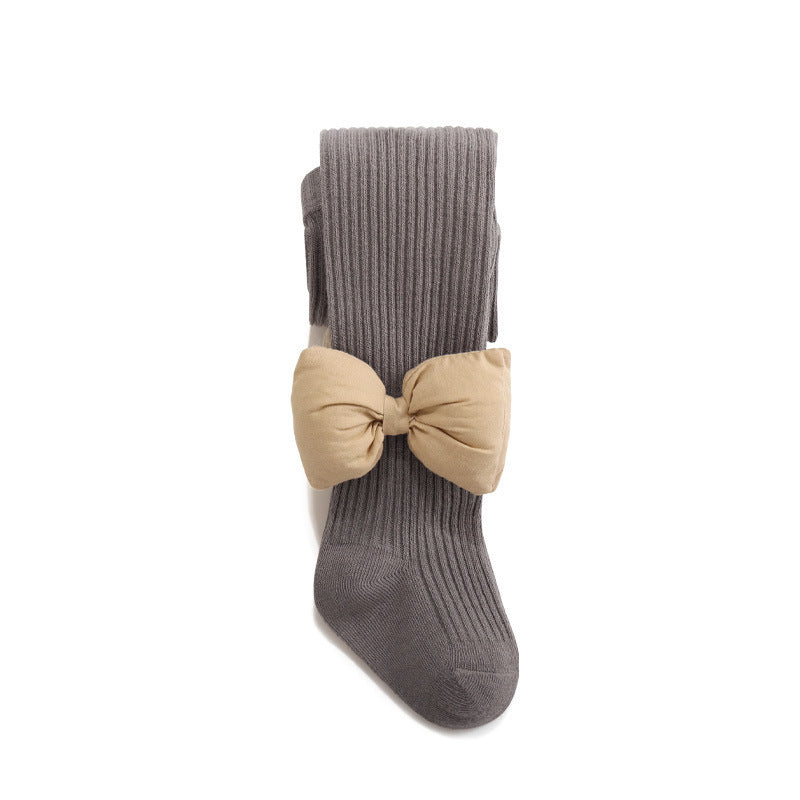 Baby girls' solid color bows in various colors, featuring a striped pattern design and double thick bows, perfect for stylish outfits.