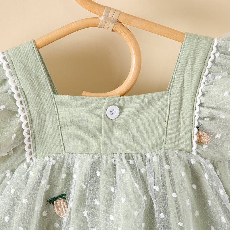 Baby girls dress featuring pineapple embroidery, polka dot lace patchwork, and square collar in vibrant green color.