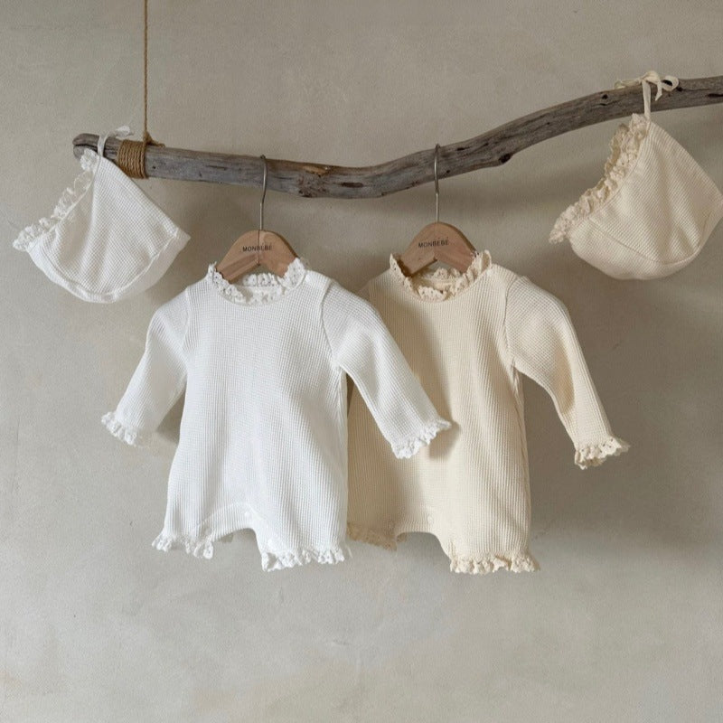 Baby girls' long sleeves onesie in waffle design with lace collar, available in white and apricot colors.