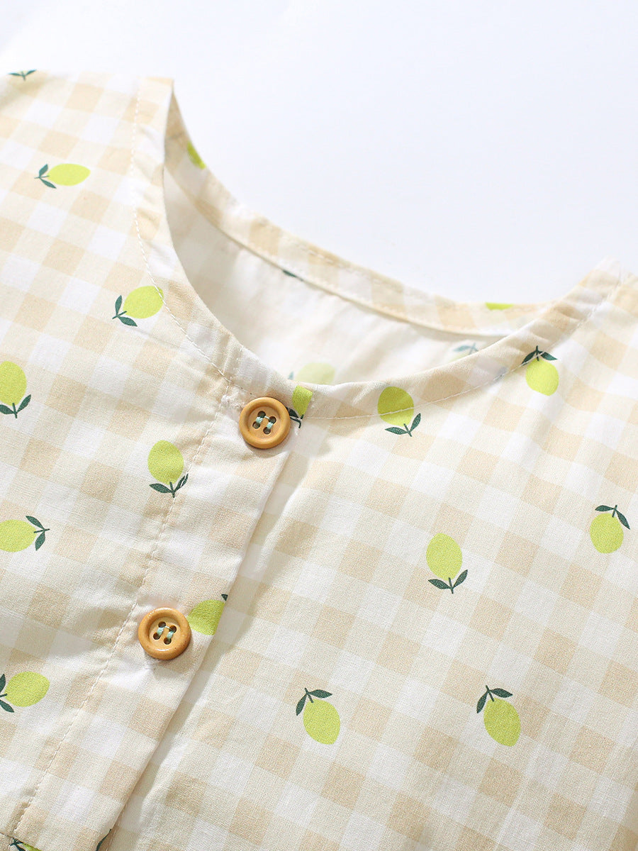 A bright yellow plaid dress for baby girls featuring short sleeves and a lemon print, perfect for summer wear.