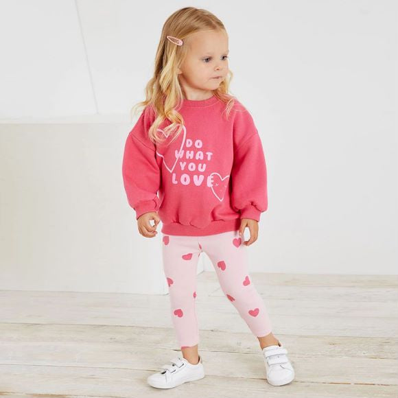 A pink baby hoodie set featuring a heart print pattern, perfect for girls aged 12 months to 10 years.