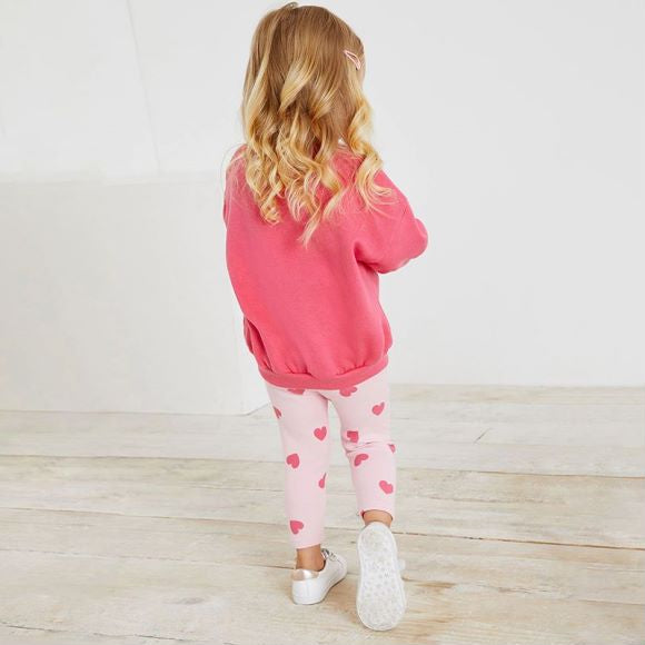 A pink baby hoodie set featuring a heart print pattern, perfect for girls aged 12 months to 10 years.