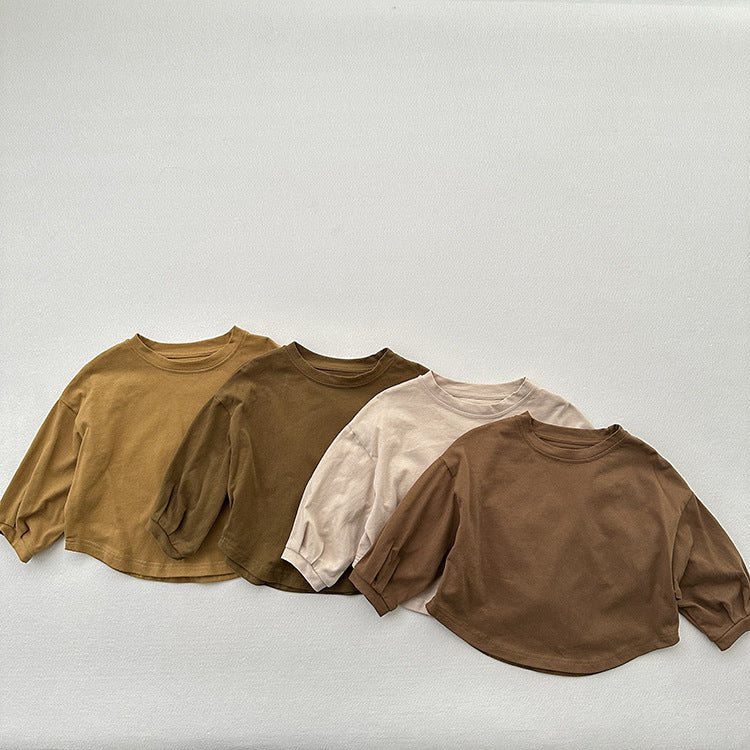 A collection of Baby Kids Unisex Casual Solid Color Crew Neck Long Sleeves Base Shirts in Green, Yellow, Beige, and Coffee colors, showcasing their soft fabric and stylish design.