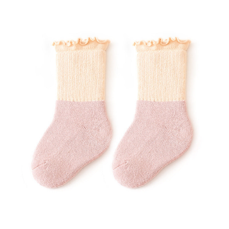 Colorful patchwork crew socks for babies and kids with ruffle fringe, available in multiple colors.