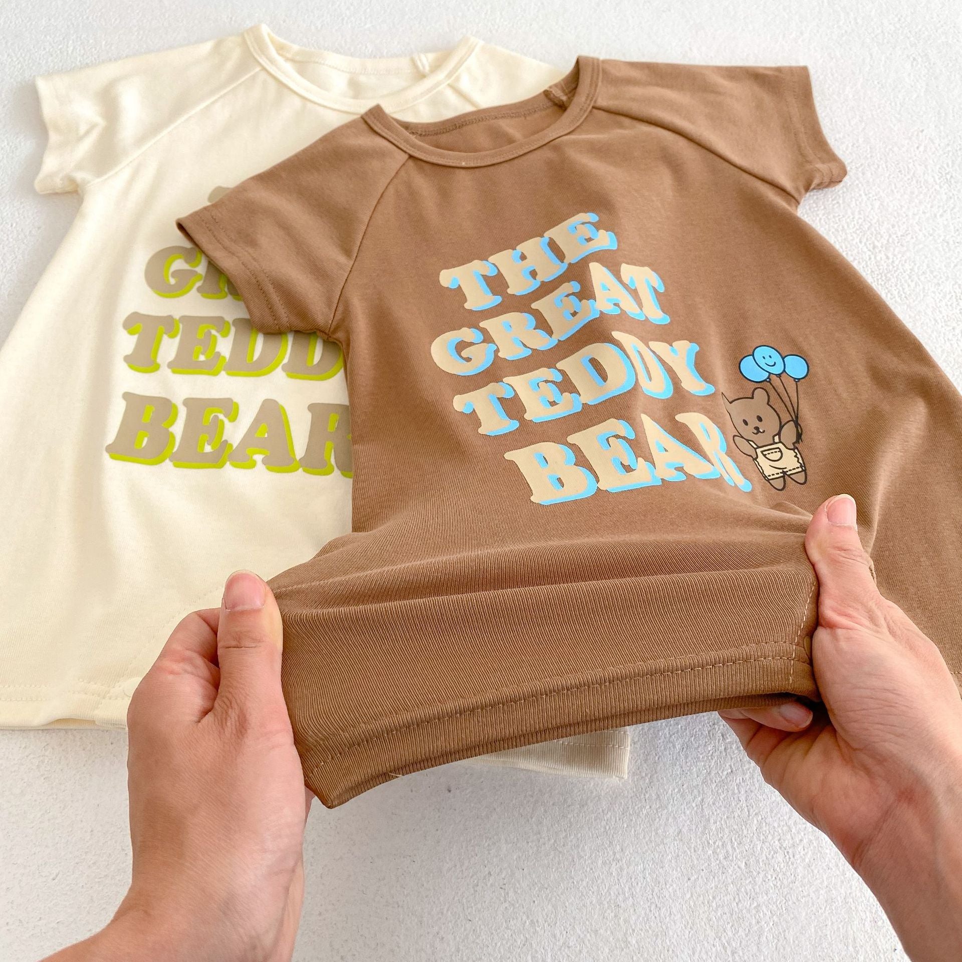 Baby Letter Graphic Crewneck Short Sleeve Casual Romper in apricot color, featuring a playful letter design, perfect for summer wear.