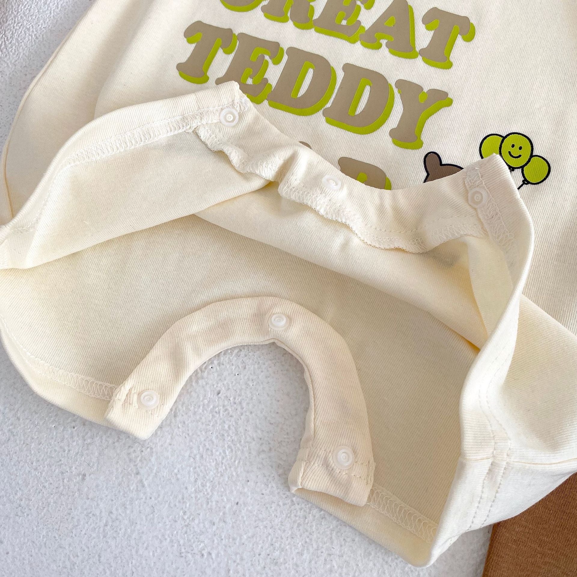 Baby Letter Graphic Crewneck Short Sleeve Casual Romper in apricot color, featuring a playful letter design, perfect for summer wear.