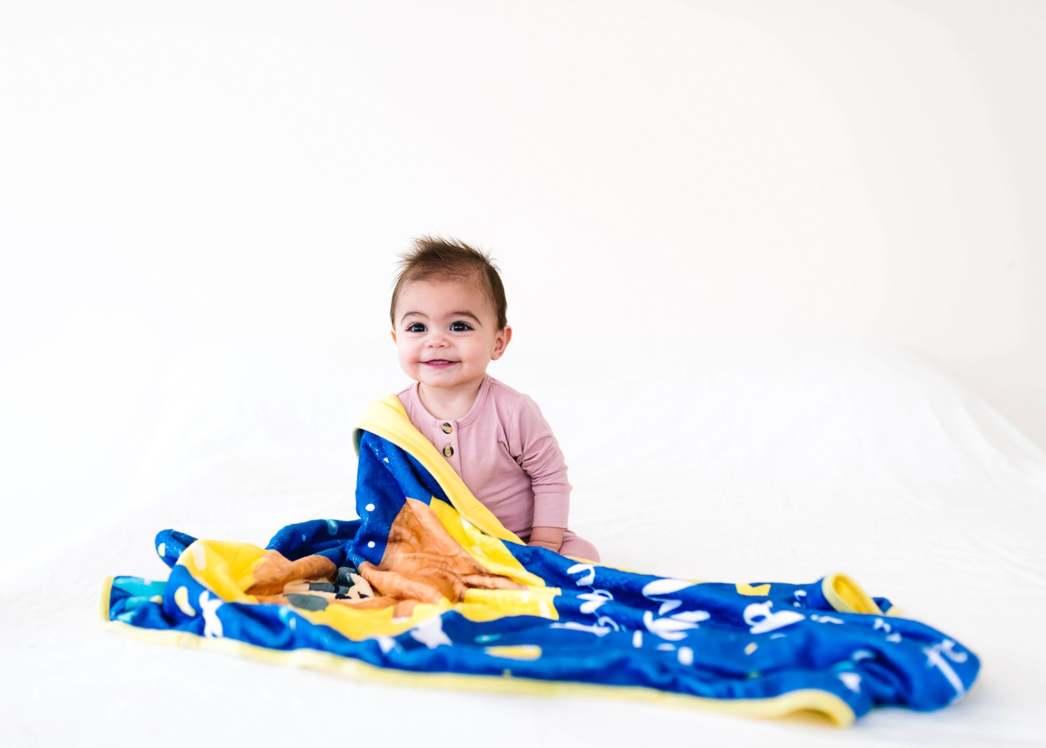 Baby Minky Sloth Blanket featuring sloths, moons, and stars in soft bamboo and minky fabric, perfect for infants and toddlers.