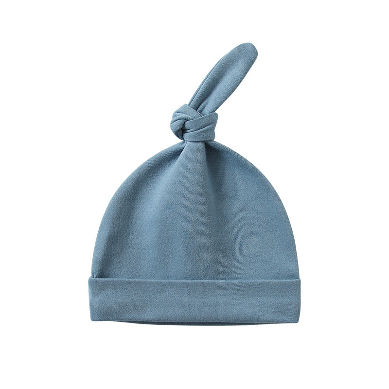 A colorful baby pullover long tail hat made of soft cotton, featuring a vibrant design suitable for both baby boys and girls.