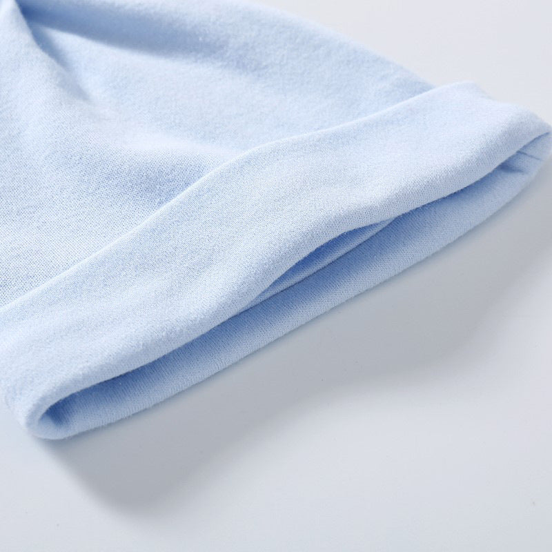 A colorful baby pullover long tail hat made of soft cotton, featuring a vibrant design suitable for both baby boys and girls.