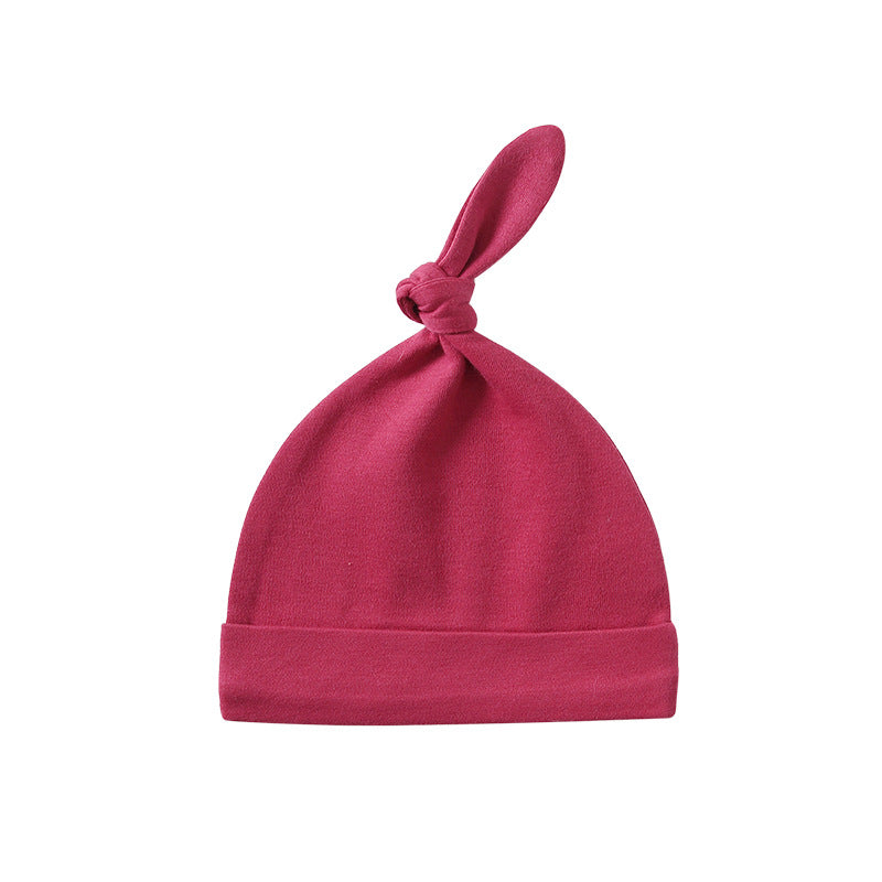 A colorful baby pullover long tail hat made of soft cotton, featuring a vibrant design suitable for both baby boys and girls.