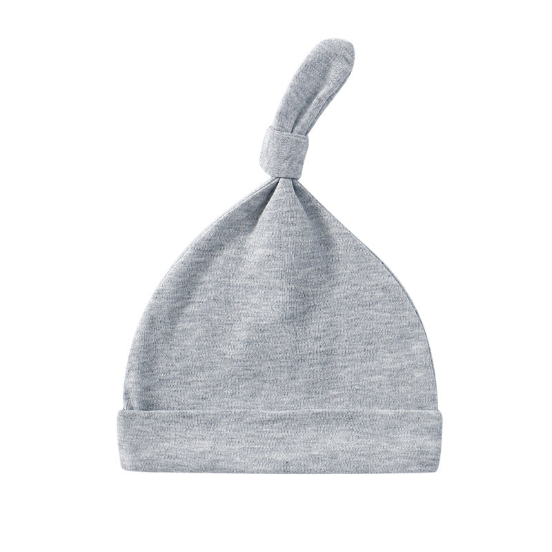 A colorful baby pullover long tail hat made of soft cotton, featuring a vibrant design suitable for both baby boys and girls.