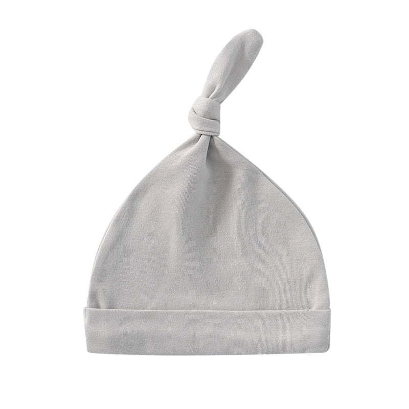 A colorful baby pullover long tail hat made of soft cotton, featuring a vibrant design suitable for both baby boys and girls.