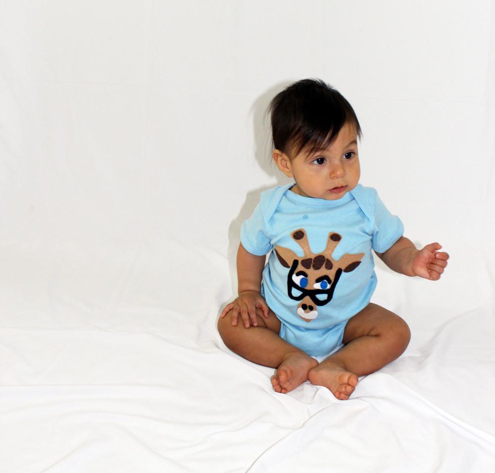 A beautifully designed Baby Onesie - Mitford featuring unique felt appliqué by mi cielo and Donald Robertson, showcasing vibrant colors and artistic flair.