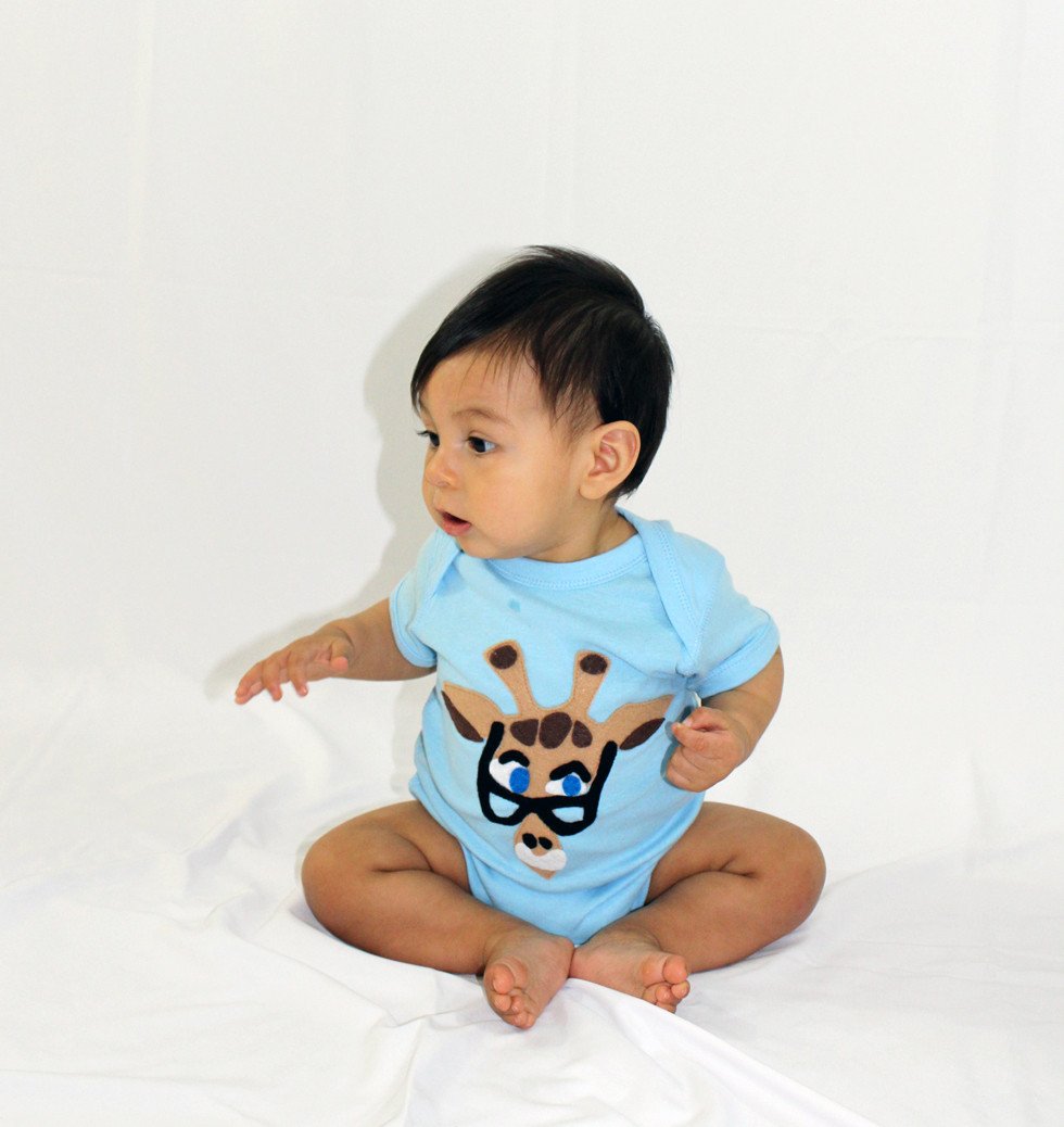 A beautifully designed Baby Onesie - Mitford featuring unique felt appliqué by mi cielo and Donald Robertson, showcasing vibrant colors and artistic flair.