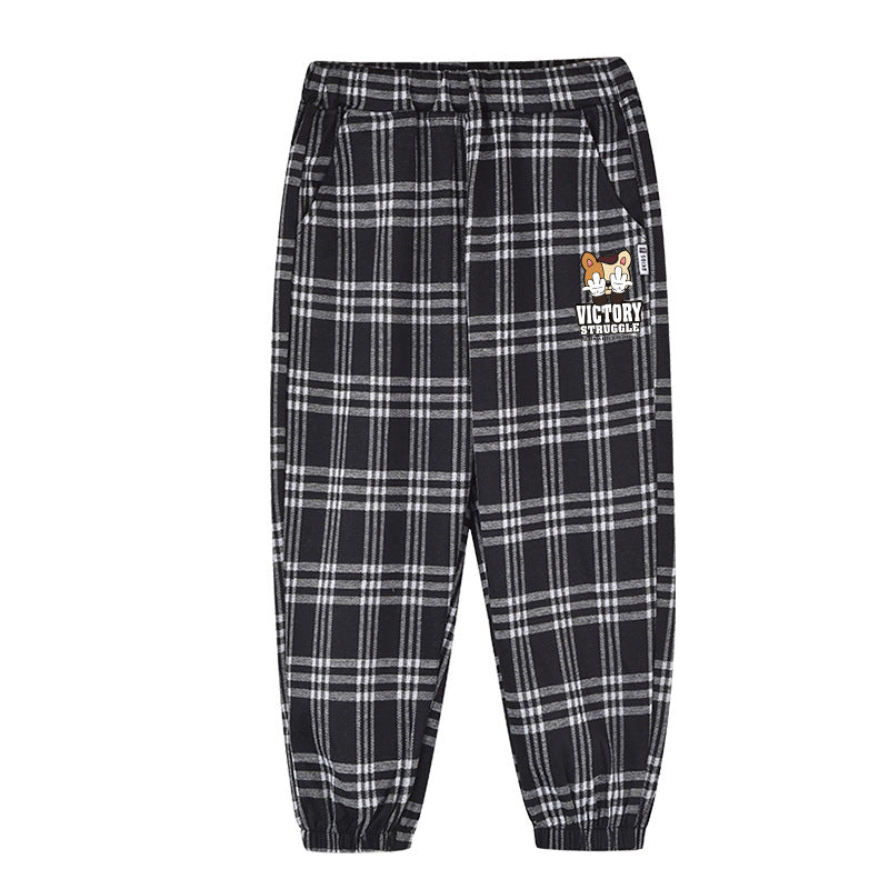 Baby plaid and cartoon animal print loose trousers in black, showcasing playful patterns and comfortable fit for children.