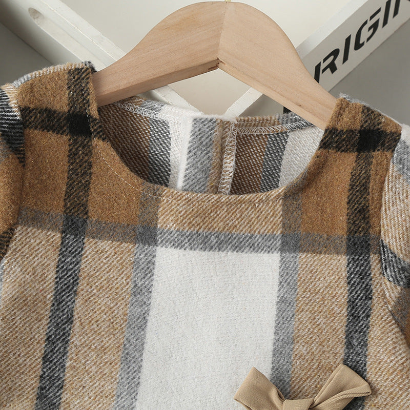 A stylish baby girl dress featuring a plaid pattern, long sleeves, and a matching hat, perfect for autumn wear.