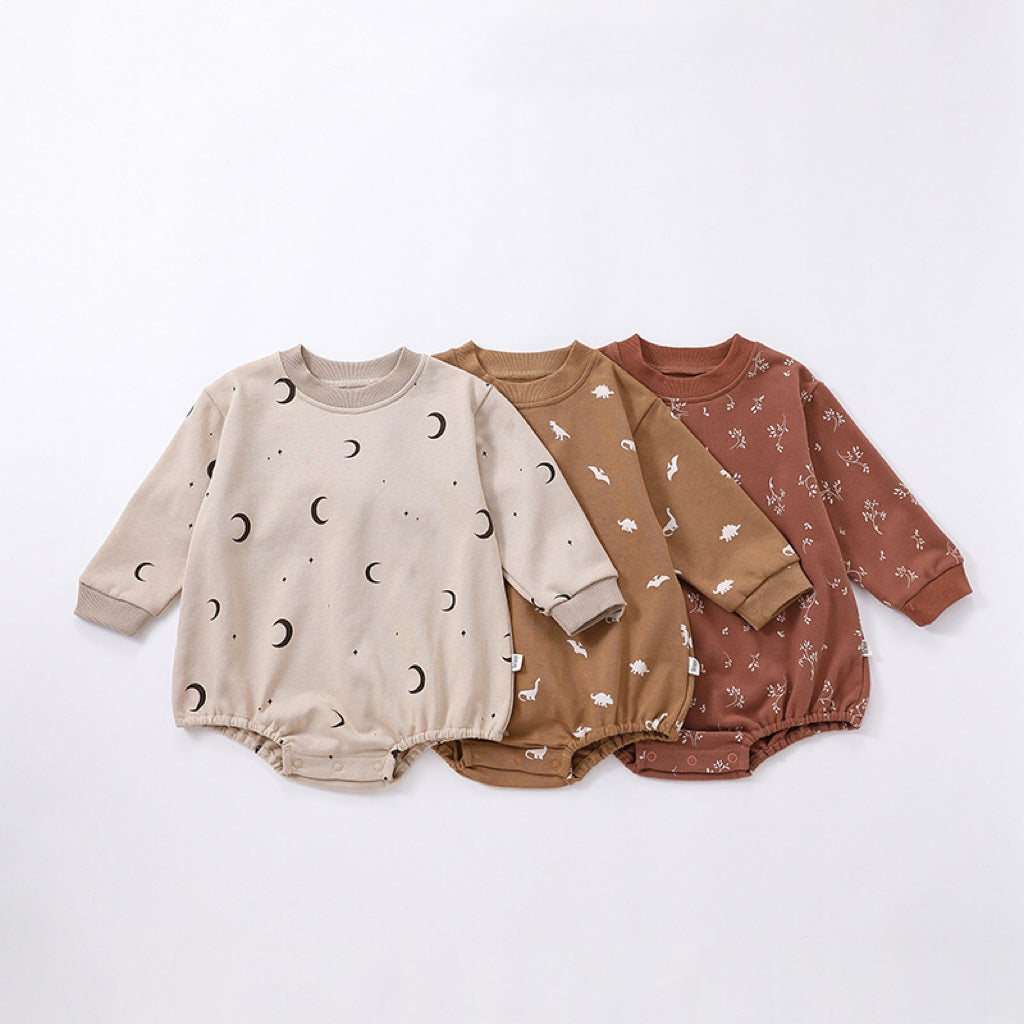 Baby Print Pattern Crewneck Long Sleeve Onesie in beige with triangle detailing, featuring floral and cartoon designs.
