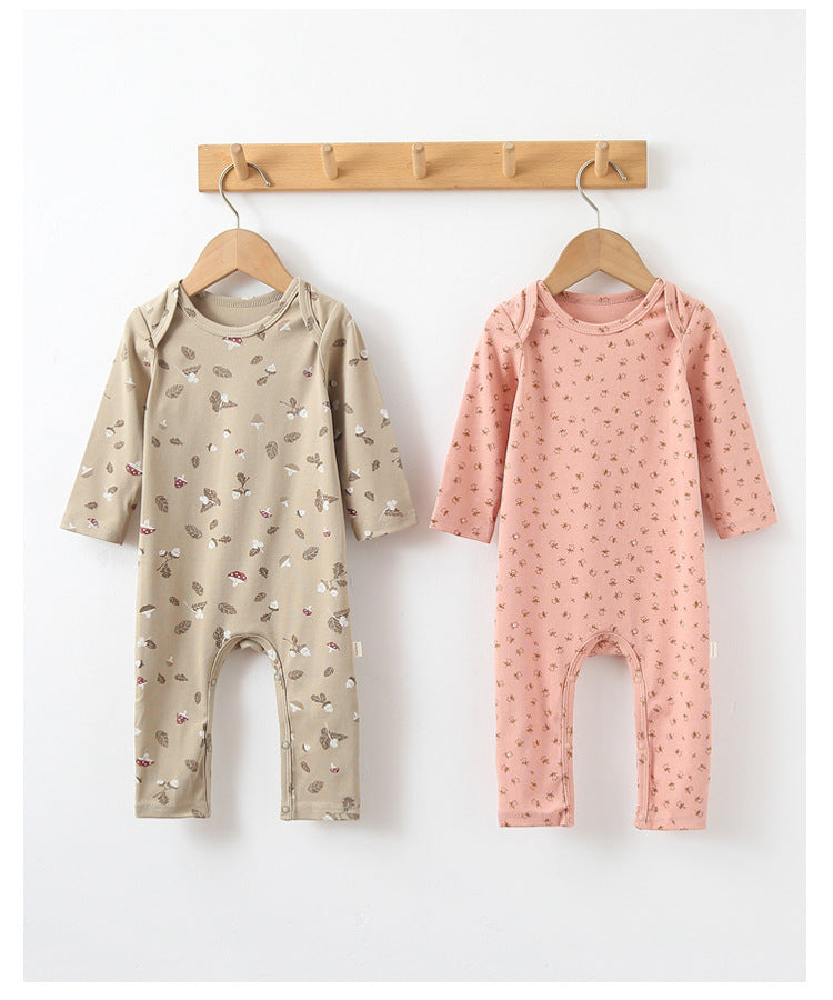 Soft cotton baby rompers with floral print and envelope neckline in pink and green colors, perfect for summer wear.
