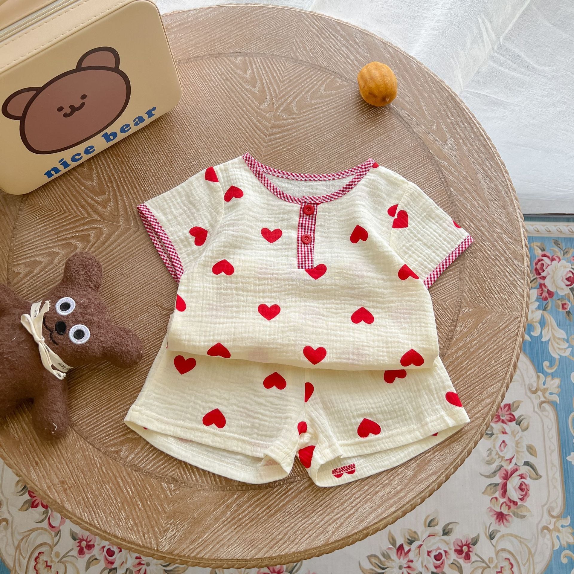 A colorful baby summer outfit featuring a print pattern t-shirt and combo shorts, perfect for keeping little ones cool and stylish.