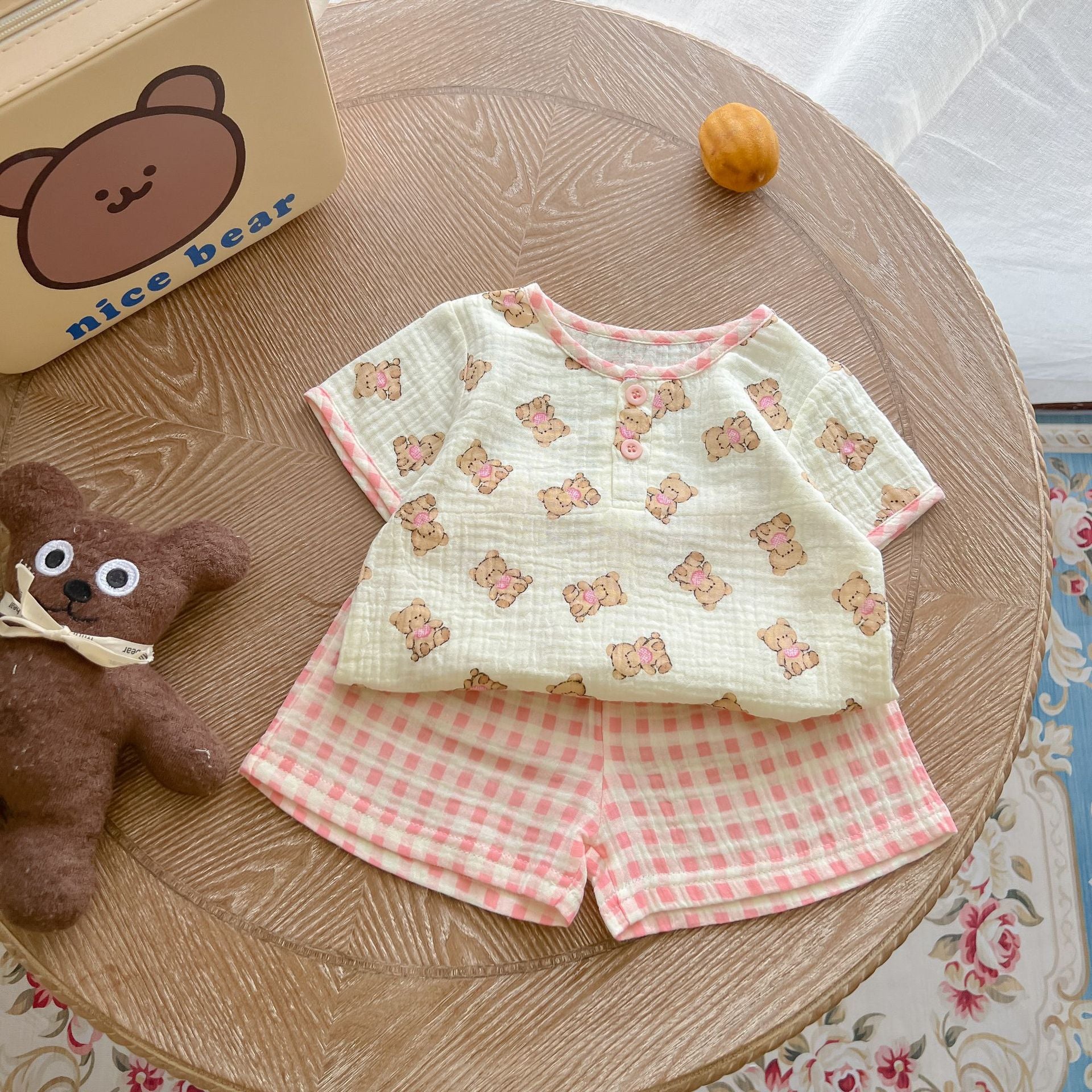 A colorful baby summer outfit featuring a print pattern t-shirt and combo shorts, perfect for keeping little ones cool and stylish.