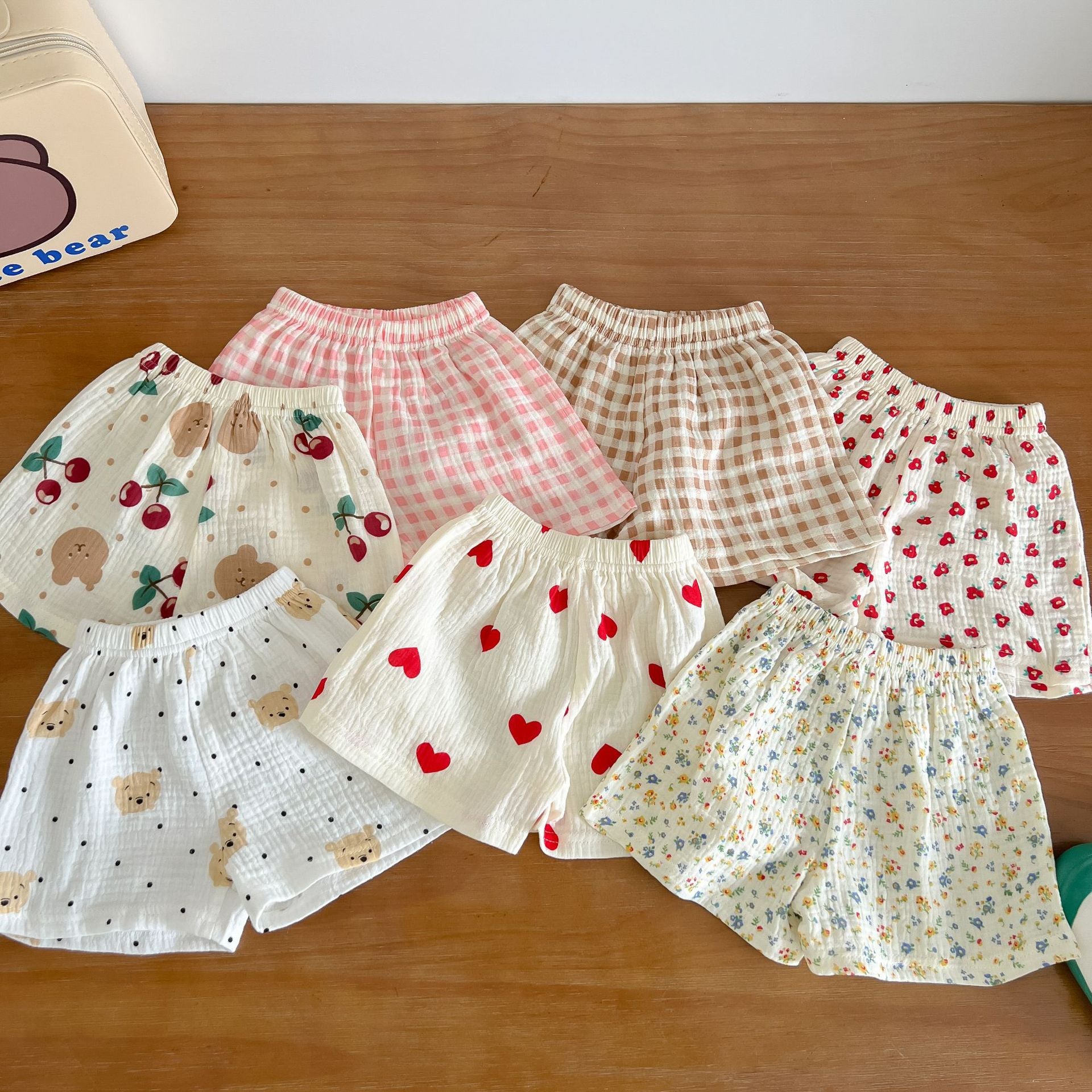 A colorful baby summer outfit featuring a print pattern t-shirt and combo shorts, perfect for keeping little ones cool and stylish.