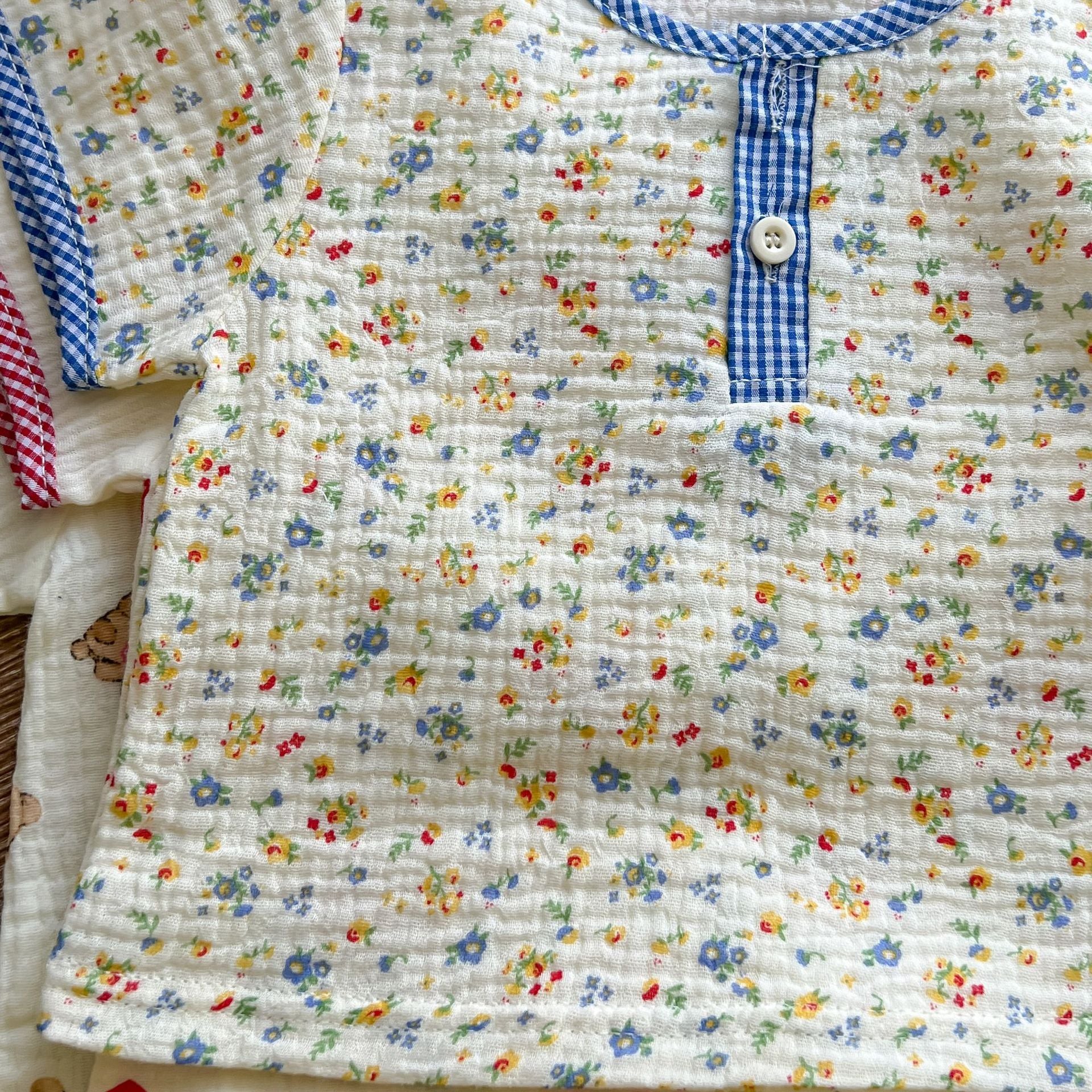 A colorful baby summer outfit featuring a print pattern t-shirt and combo shorts, perfect for keeping little ones cool and stylish.