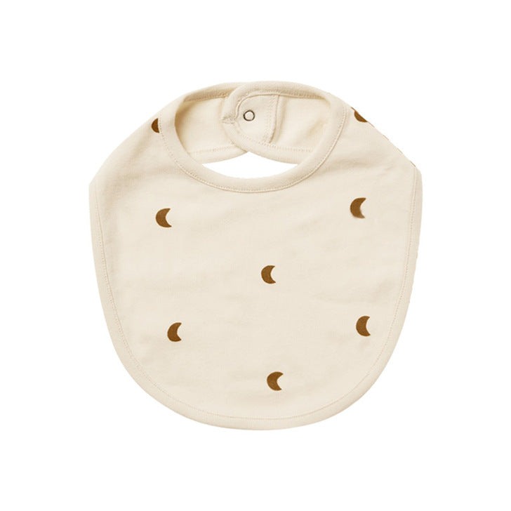 Cute baby bibs made of pure cotton with printed patterns and covered buttons, available in various colors.