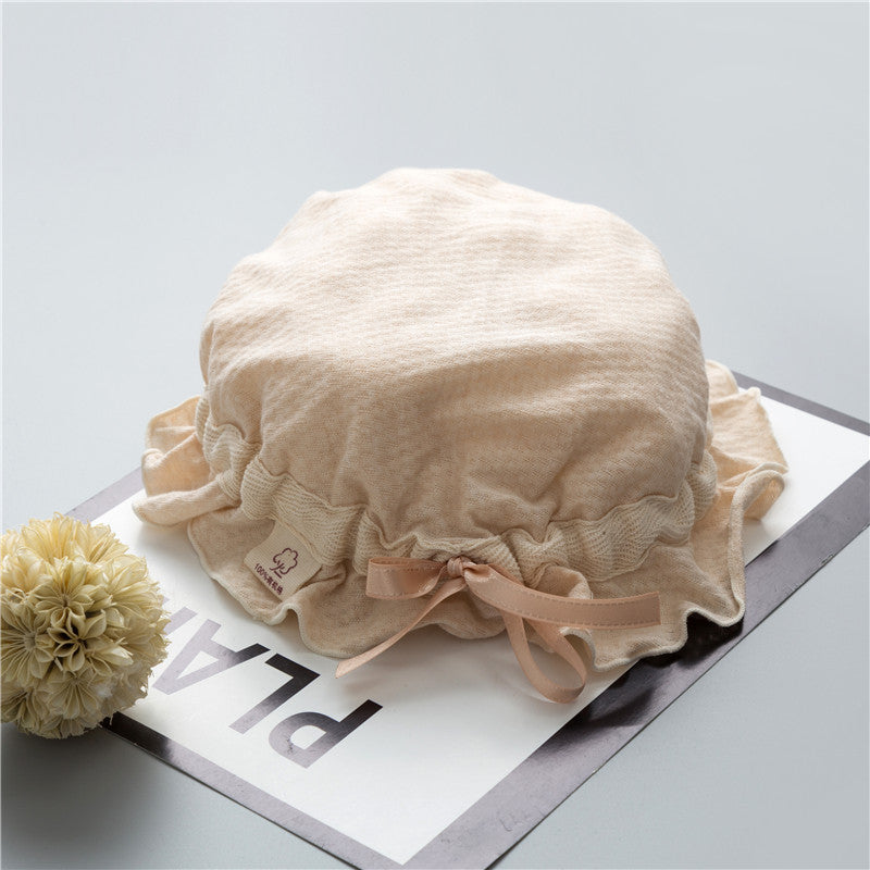 Adorable baby hats with ruffle design and bow decoration in various colors, perfect for stylish infants.