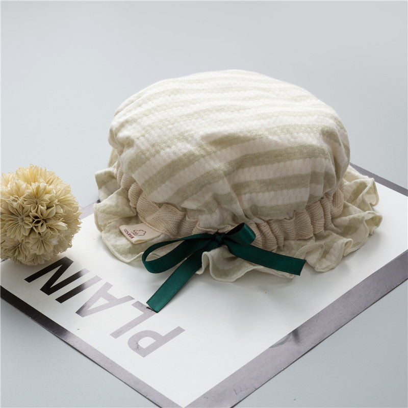 Adorable baby hats with ruffle design and bow decoration in various colors, perfect for stylish infants.