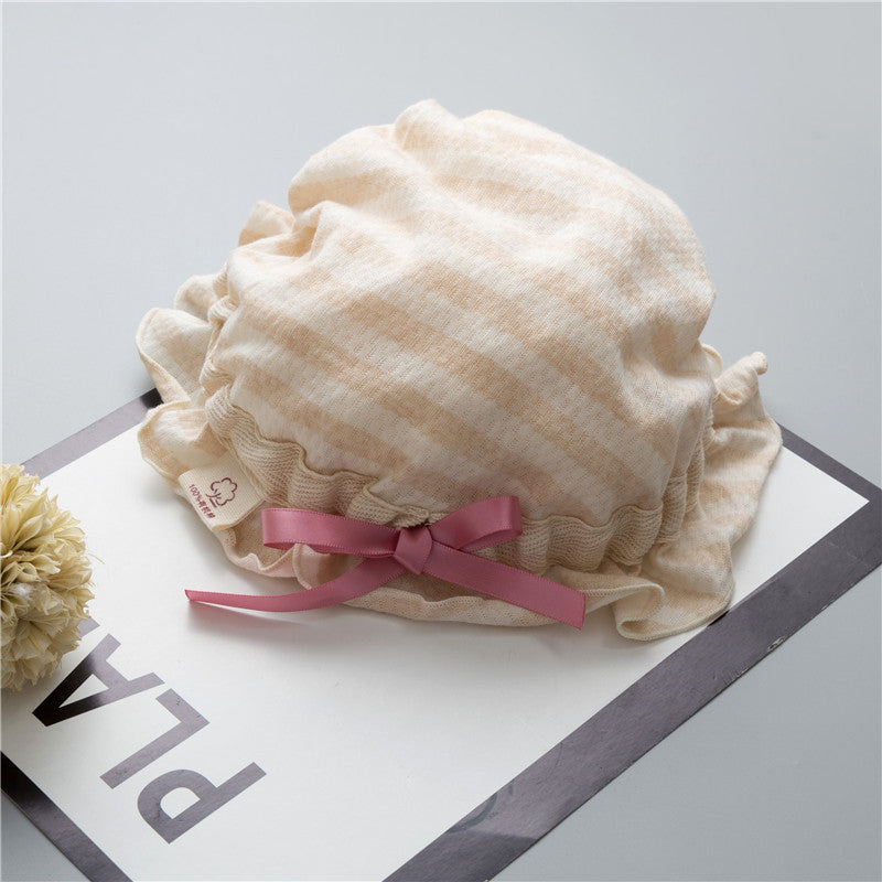 Adorable baby hats with ruffle design and bow decoration in various colors, perfect for stylish infants.