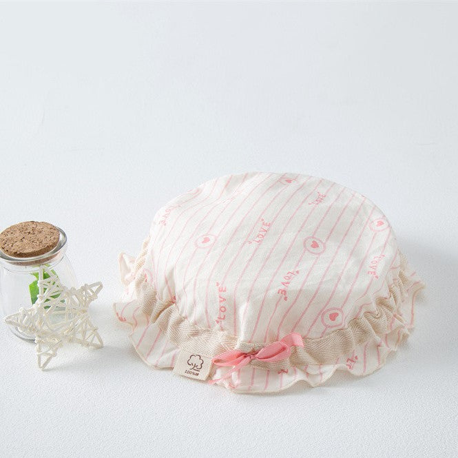 Adorable baby hats with ruffle design and bow decoration in various colors, perfect for stylish infants.