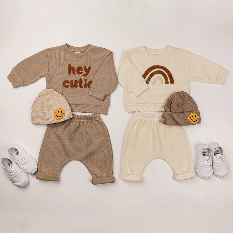 A cozy Baby Rainbow & Letter Graphic Hoodie and Pants Set in beige, featuring colorful rainbow and letter designs, perfect for babies.