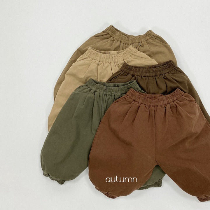 A pair of baby solid color pants in various colors, showcasing their loose and comfy design suitable for both boys and girls.