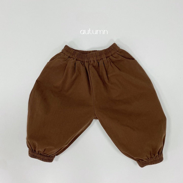 A pair of baby solid color pants in various colors, showcasing their loose and comfy design suitable for both boys and girls.