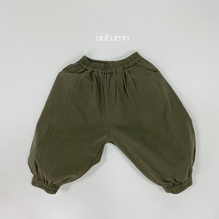 A pair of baby solid color pants in various colors, showcasing their loose and comfy design suitable for both boys and girls.