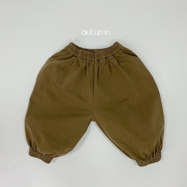 A pair of baby solid color pants in various colors, showcasing their loose and comfy design suitable for both boys and girls.