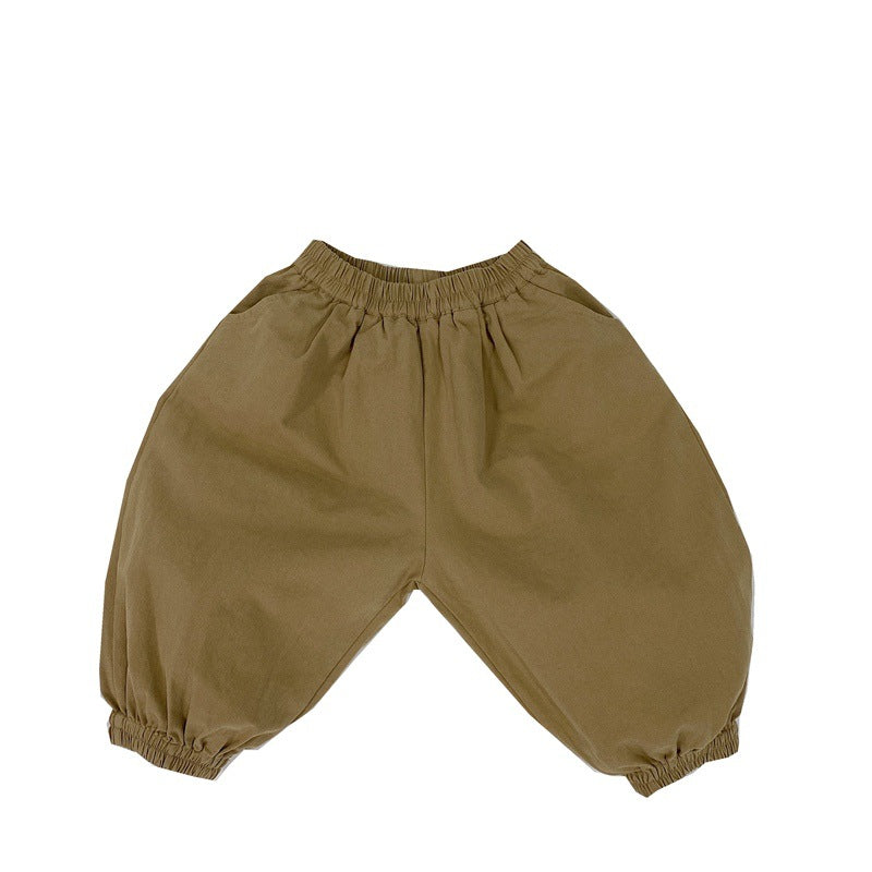 A pair of baby solid color pants in various colors, showcasing their loose and comfy design suitable for both boys and girls.